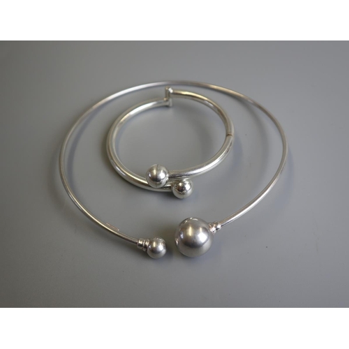 215 - Silver slave bangle together with a matching silver collar