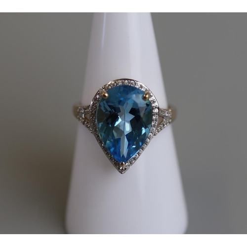 238 - Gold blue topaz & diamond set ring - Size M½