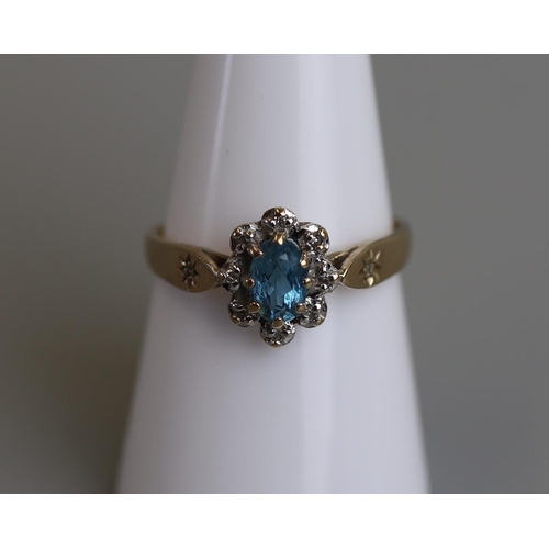 266 - Gold blue topaz & diamond cluster ring - Size O½