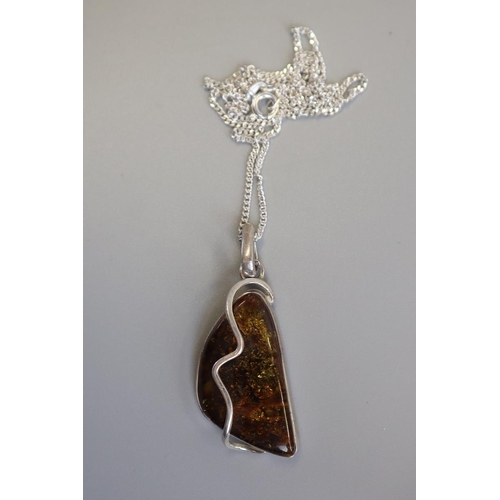 277 - Silver & amber pendant on chain