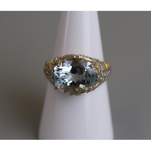 69 - Gold aquamarine & diamond set ring - Size N