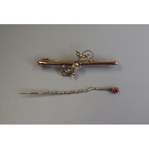 86 - Gold pearl set bar brooch together with gold stick pin