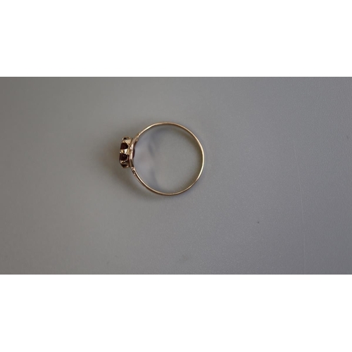 116 - Gold child's garnet set ring - Size J½