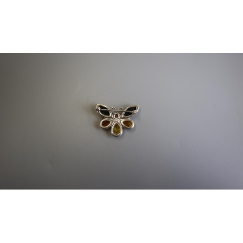 124 - Silver & amber butterfly brooch