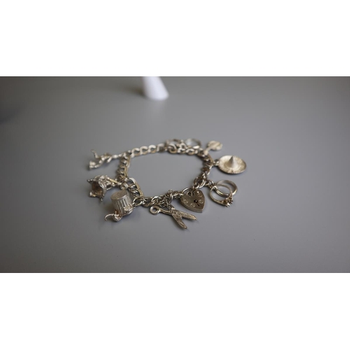 168 - Silver charm bracelet