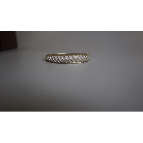 196 - Fine gold & diamond bangle