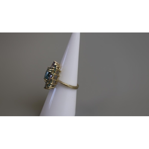 203 - Gold blue topaz set ring - Size K