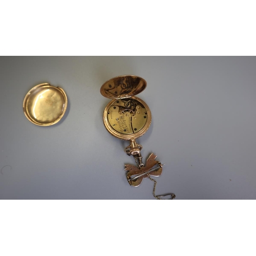 225 - 14ct gold Waltham fob watch (damaged) on gold bow