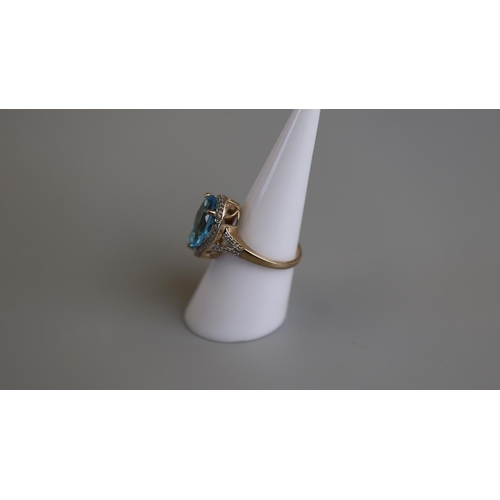 238 - Gold blue topaz & diamond set ring - Size M½