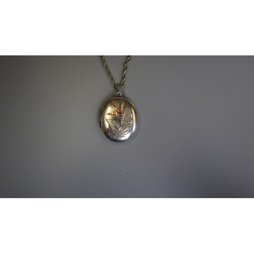 68 - Silver locket with inset gold bird on silver chain