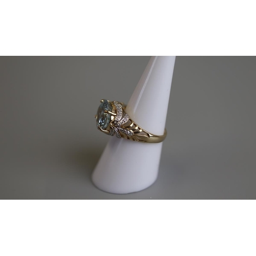 69 - Gold aquamarine & diamond set ring - Size N