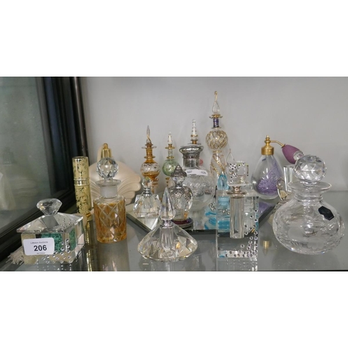 206 - Collection of perfume bottles to include crystal and silver top