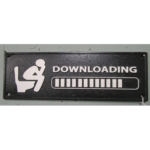 296 - Cast iron comical downloading sign