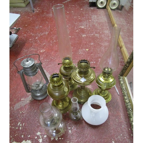 333 - Collection of brass oil lamps and Tilly lamps