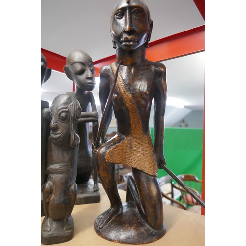 268 - Collection of African tribal figures together with a framed plaque of a dancing Buddha