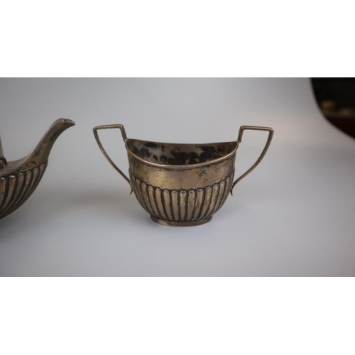 27 - Hallmarked silver teapot, sugar bowl & milk jug - Approx gross weight: 388g