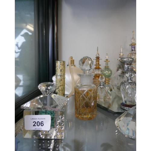 206 - Collection of perfume bottles to include crystal and silver top