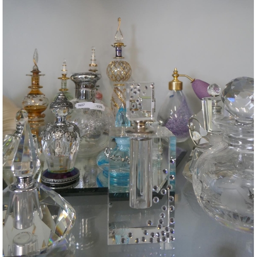 206 - Collection of perfume bottles to include crystal and silver top