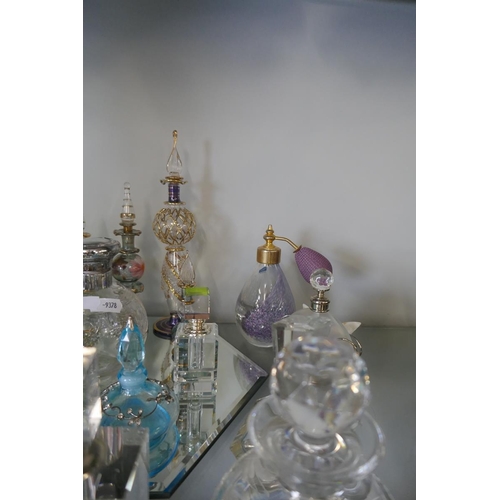 206 - Collection of perfume bottles to include crystal and silver top