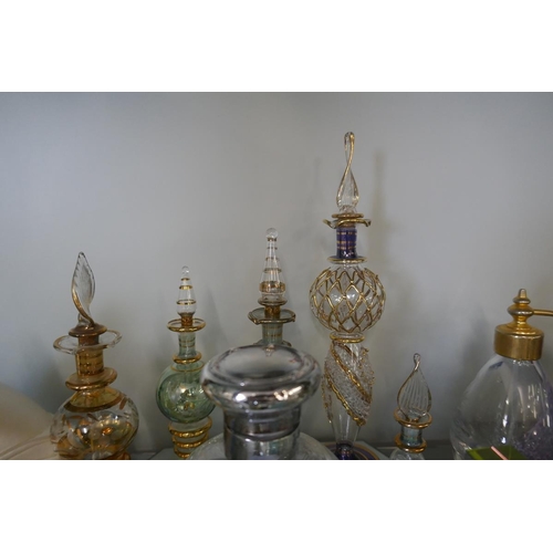 206 - Collection of perfume bottles to include crystal and silver top