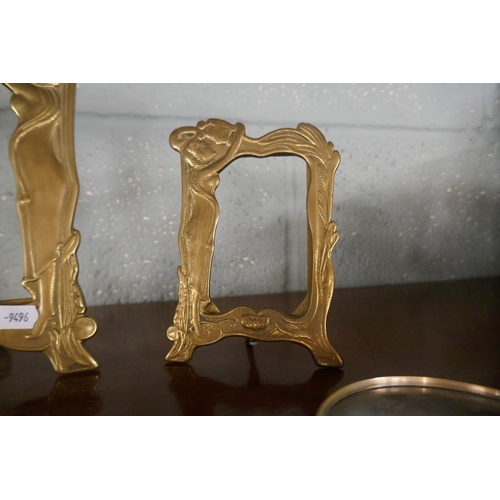 236 - 2 Art Nouveau brass photo frames together with a large magnifying glass with cut glass handle