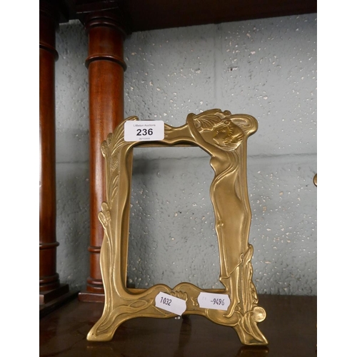 236 - 2 Art Nouveau brass photo frames together with a large magnifying glass with cut glass handle