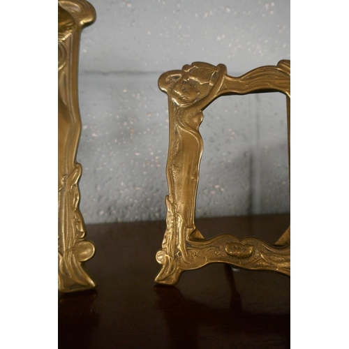 236 - 2 Art Nouveau brass photo frames together with a large magnifying glass with cut glass handle