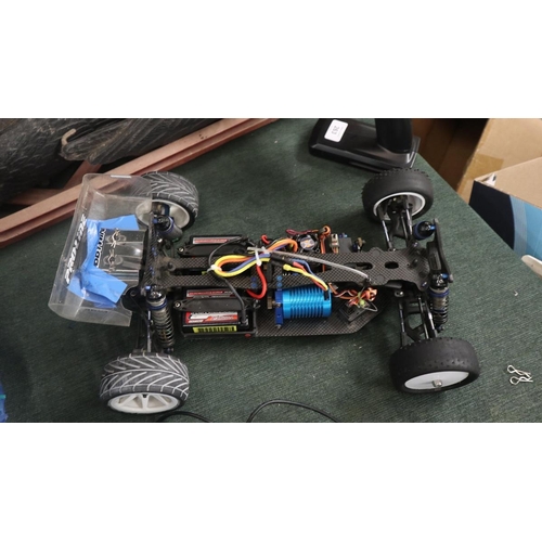263 - Team Associated RC10 brushless radio controlled car with Li-po battery, controller, spare shell etc.