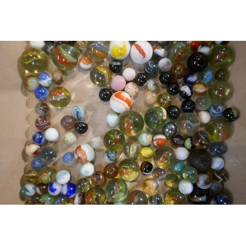 227 - Tin of vintage marbles