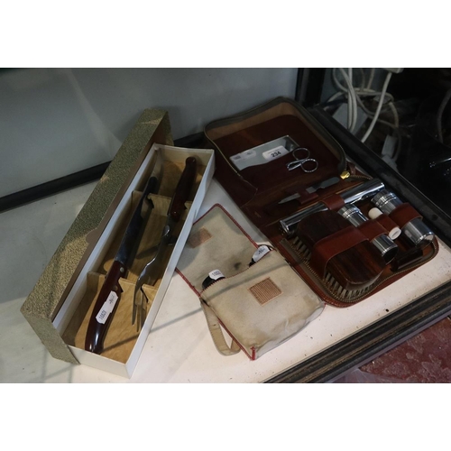 234 - Leather cased grooming kit together with carving set and binoculars