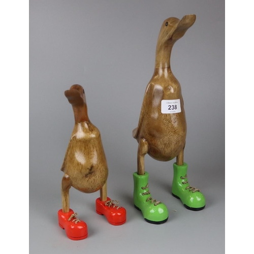 238 - 2 wooden ducks in boots