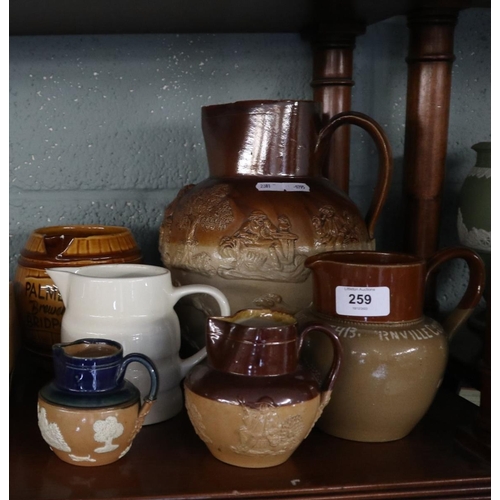 259 - Collection of jugs to include Royal Doulton Harvest jugs and Cadburys cocoa jug etc