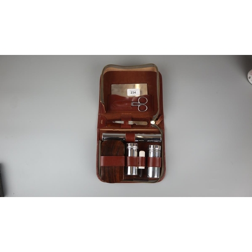 234 - Leather cased grooming kit together with carving set and binoculars