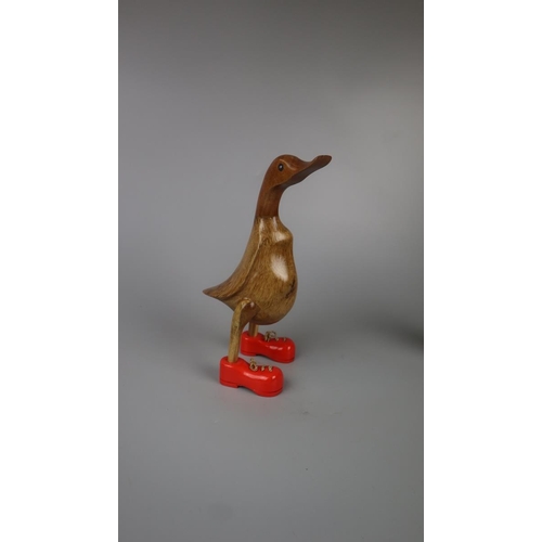 238 - 2 wooden ducks in boots