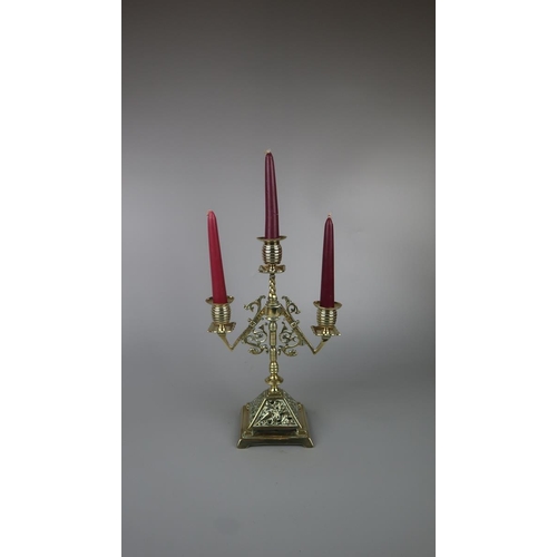 241 - Pair of brass candelabra to include candles