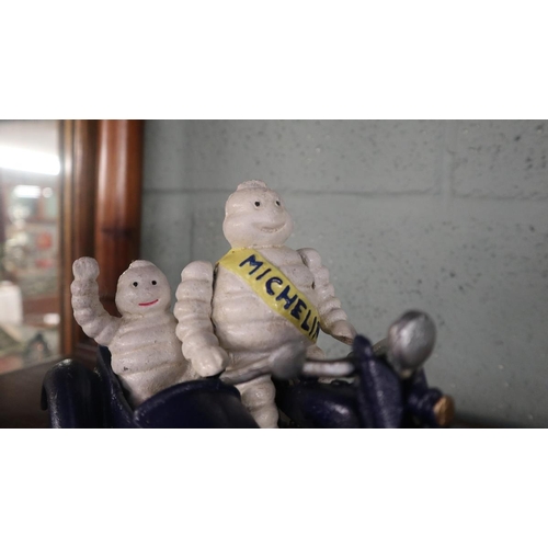 243 - Cast iron Michelin man motorcycle and side car figure