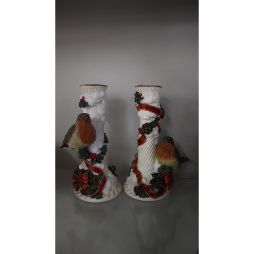 249 - Collection of robin ornaments to include a pair of Christmas candlesticks