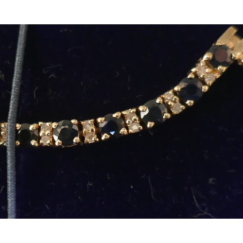 19 - Gold sapphire & diamond tennis bracelet