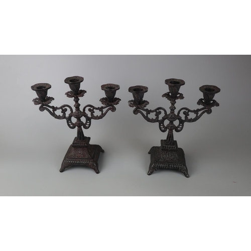 139 - Pair of cast iron candelabra - Approx height: 24cm