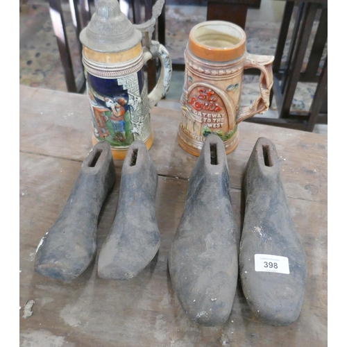 398 - 2 pairs of cast iron shoe lasts together with 2 steins
