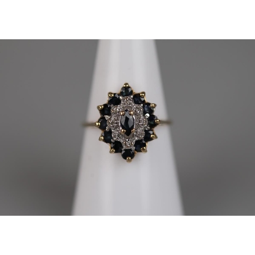 43 - 9ct Gold diamond and sapphire cluster ring - Approx size L