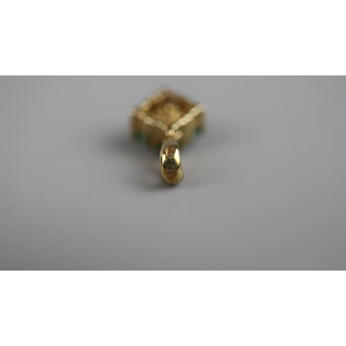 13 - 9ct gold emerald set pendent
