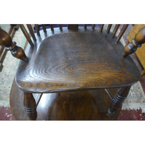 264 - Early comb back elm seated armchair with crinoline stretcher