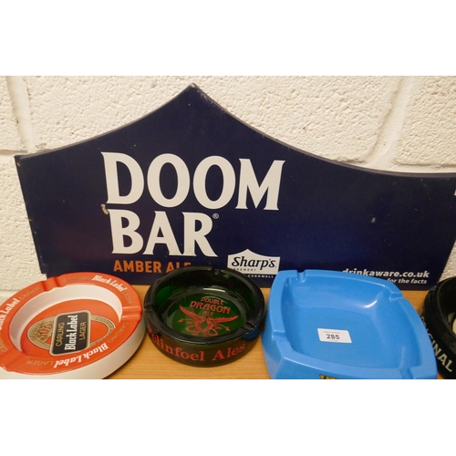 285 - Quantity of pub ashtrays with Doom Bar pub sign