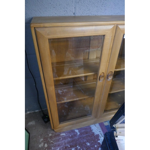 348 - Blonde elm Ercol glazed bookcase - Approx size: W: 92cm D: 29cm H: 98cm