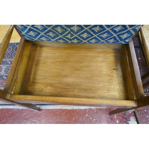 395 - Edwardian upholstered piano stool with sheet music compartment 