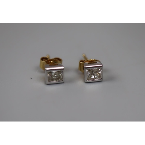39 - Fine pair of 18ct gold princess cut diamond stud earrings 