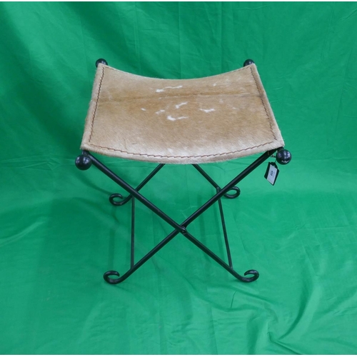 459 - Cow hide folding cast iron stool