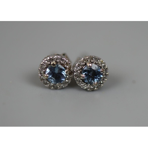 94 - 18ct gold diamond and aquamarine stud earrings