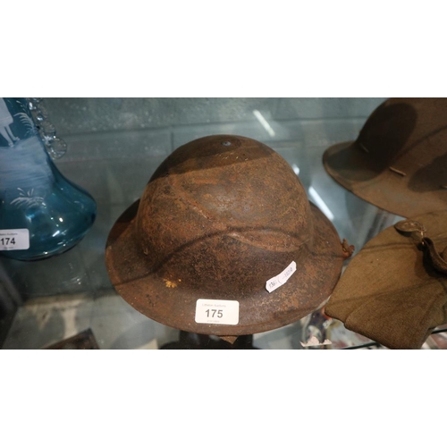 175 - 2 military helmets together with military cap